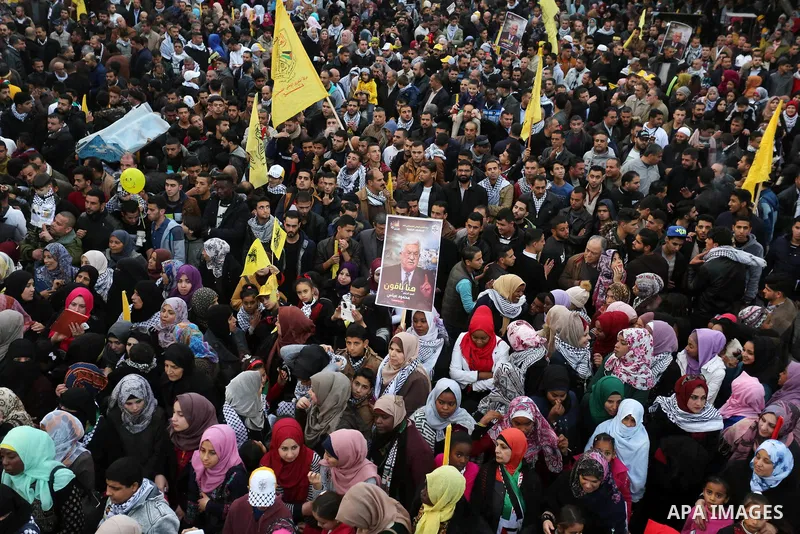 Palestinian supporters of the Fatah movement take part during a rally in Gaza City on December 31, 2017, marking the 53rd anniversary of the creation of the political party. Photo by Ashraf Amra