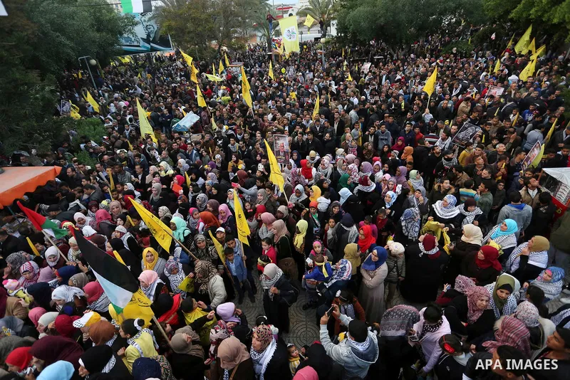 Palestinian supporters of the Fatah movement take part during a rally in Gaza City on December 31, 2017, marking the 53rd anniversary of the creation of the political party. Photo by Ashraf Amra