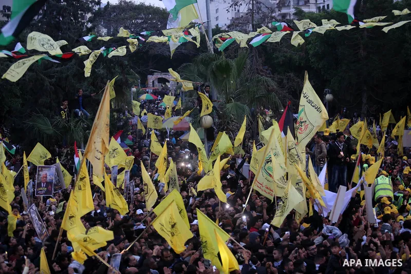 Palestinian supporters of the Fatah movement take part during a rally in Gaza City on December 31, 2017, marking the 53rd anniversary of the creation of the political party. Photo by Ashraf Amra