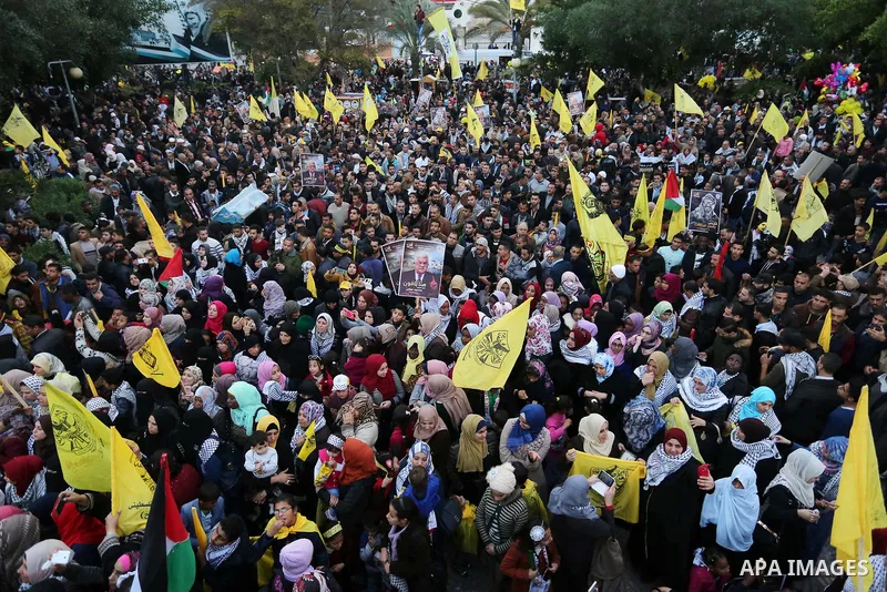 Palestinian supporters of the Fatah movement take part during a rally in Gaza City on December 31, 2017, marking the 53rd anniversary of the creation of the political party. Photo by Ashraf Amra