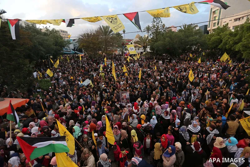 Palestinian supporters of the Fatah movement take part during a rally in Gaza City on December 31, 2017, marking the 53rd anniversary of the creation of the political party. Photo by Ashraf Amra