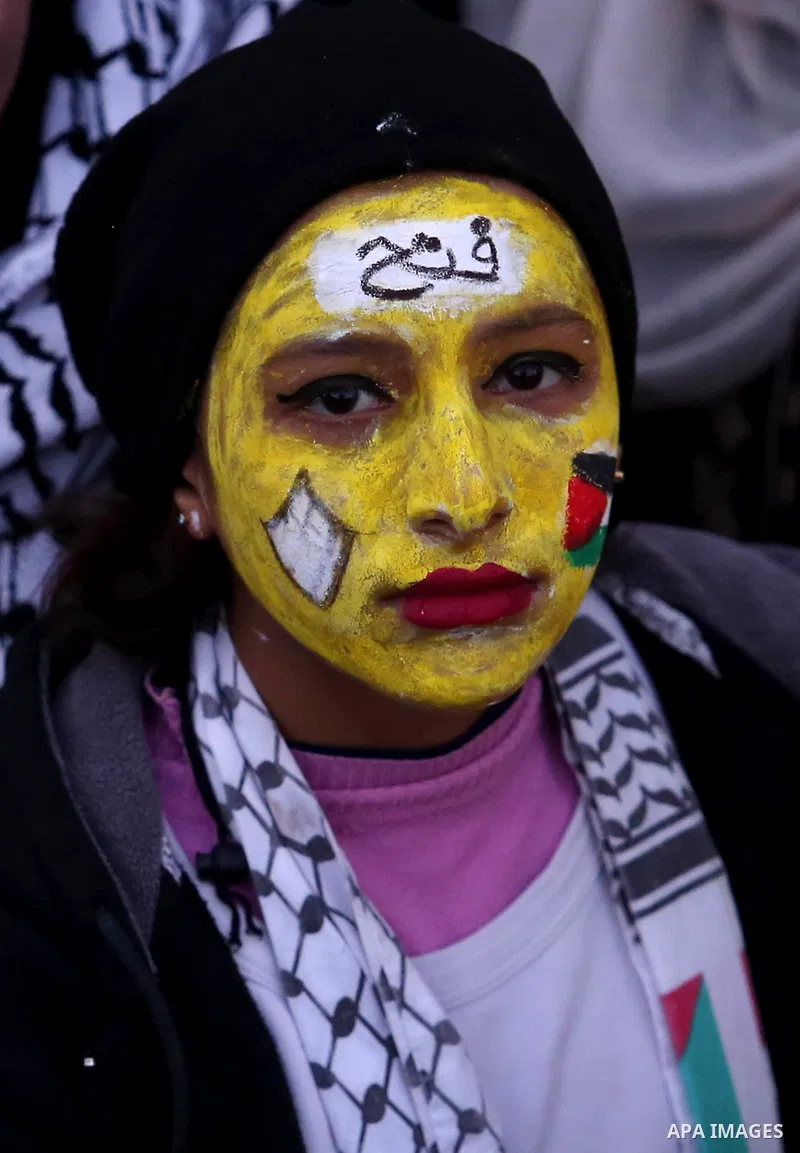 Palestinian supporters of the Fatah movement take part during a rally in Gaza City on December 31, 2017, marking the 53rd anniversary of the creation of the political party. Photo by Ashraf Amra