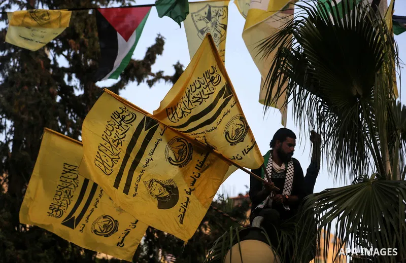 Palestinian supporters of the Fatah movement take part during a rally in Gaza City on December 31, 2017, marking the 53rd anniversary of the creation of the political party. Photo by Mohammed Dahman
