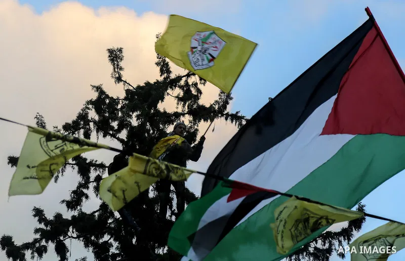 Palestinian supporters of the Fatah movement take part during a rally in Gaza City on December 31, 2017, marking the 53rd anniversary of the creation of the political party. Photo by Mohammed Dahman