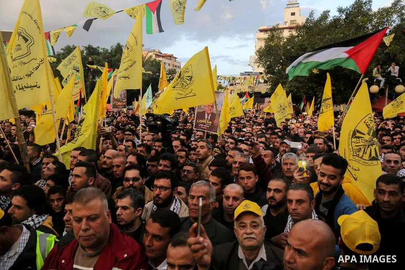 Palestinian supporters of the Fatah movement take part during a rally in Gaza City on December 31, 2017, marking the 53rd anniversary of the creation of the political party. Photo by Mohammed Dahman