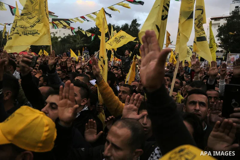 Palestinian supporters of the Fatah movement take part during a rally in Gaza City on December 31, 2017, marking the 53rd anniversary of the creation of the political party. Photo by Mohammed Dahman