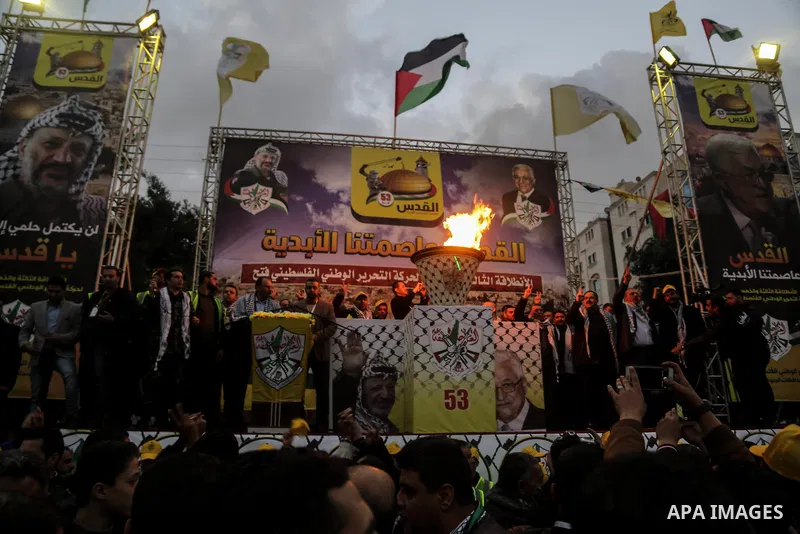 Palestinian supporters of the Fatah movement take part during a rally in Gaza City on December 31, 2017, marking the 53rd anniversary of the creation of the political party. Photo by Mohammed Dahman