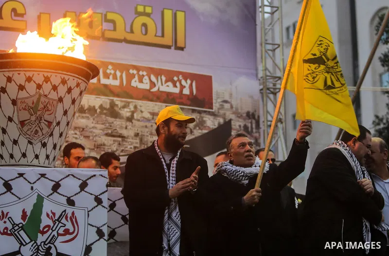 Palestinian supporters of the Fatah movement take part during a rally in Gaza City on December 31, 2017, marking the 53rd anniversary of the creation of the political party. Photo by Mohammed Dahman