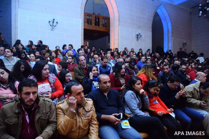 Egyptian Christians pray during a New Year's Eve mass, at Kasr el-Dobara evangelical Church, in Cairo, Egypt on December 31, 2017. Photo by Amr Sayed
