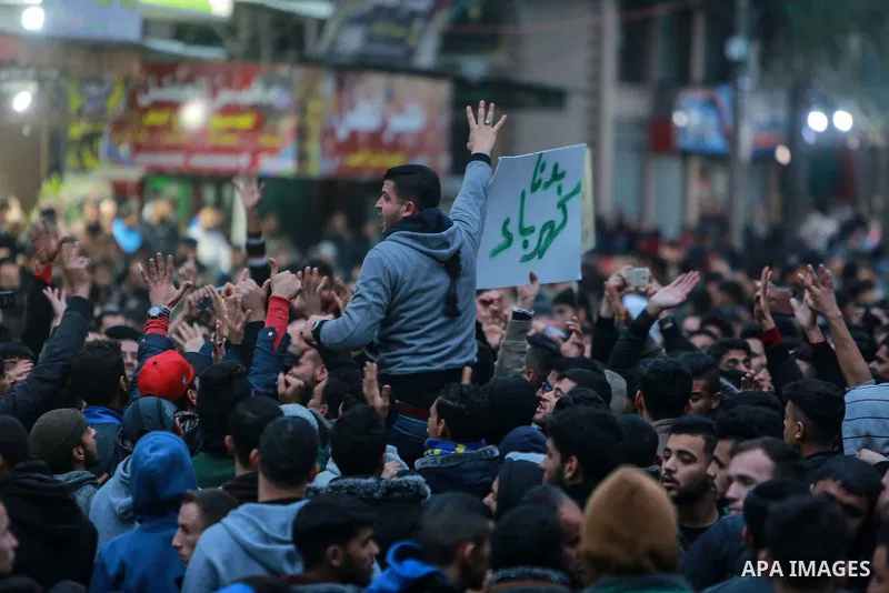 Palestinians participate in a demonstration to support the palestinian reconciliation efforts between Fatah and Hamas, and demand better living conditions, in Jabalia in the northern Gaza Strip on January 04, 2018. Photo...
