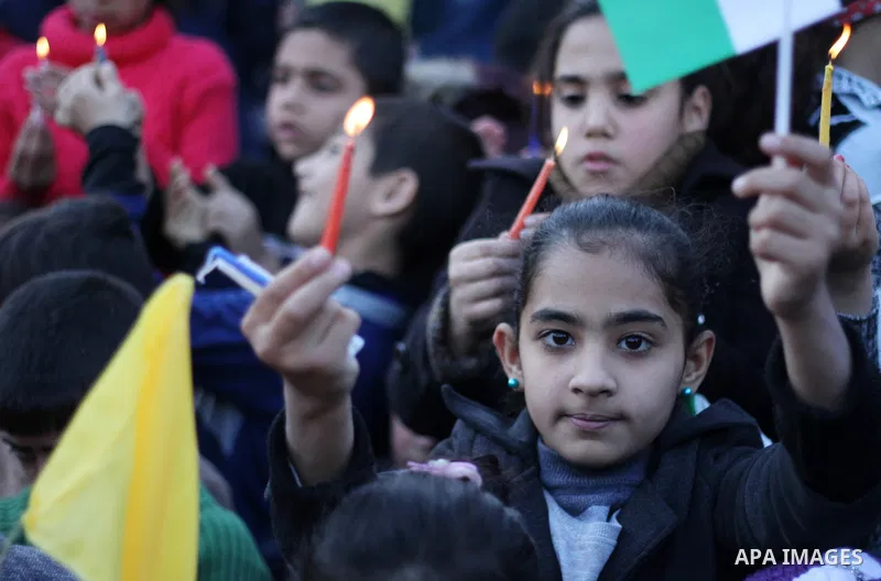 Palestinian children hold a candles during a protest in support of Palestinian teenager Ahed Tamimi, 16-year-old in Gaza city on January 8, 2018. Israel charged Tamimi with 12 counts including assault on January 1 follow...