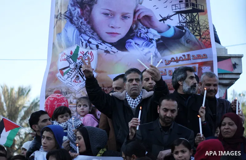 Palestinians hold a candles during a protest in support of Palestinian teenager Ahed Tamimi, 16-year-old in Gaza city on January 8, 2018. Israel charged Tamimi with 12 counts including assault on January 1 following her...