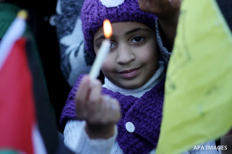 A Palestinian girl holds a candle during a protest in support of Palestinian teenager Ahed Tamimi, 16-year-old in Gaza city on January 8, 2018. Israel charged Tamimi with 12 counts including assault on January 1 followin...