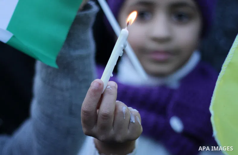 A Palestinian girl holds a candle during a protest in support of Palestinian teenager Ahed Tamimi, 16-year-old in Gaza city on January 8, 2018. Israel charged Tamimi with 12 counts including assault on January 1 followin...