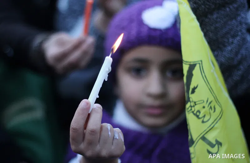 A Palestinian girl holds a candle during a protest in support of Palestinian teenager Ahed Tamimi, 16-year-old in Gaza city on January 8, 2018. Israel charged Tamimi with 12 counts including assault on January 1 followin...