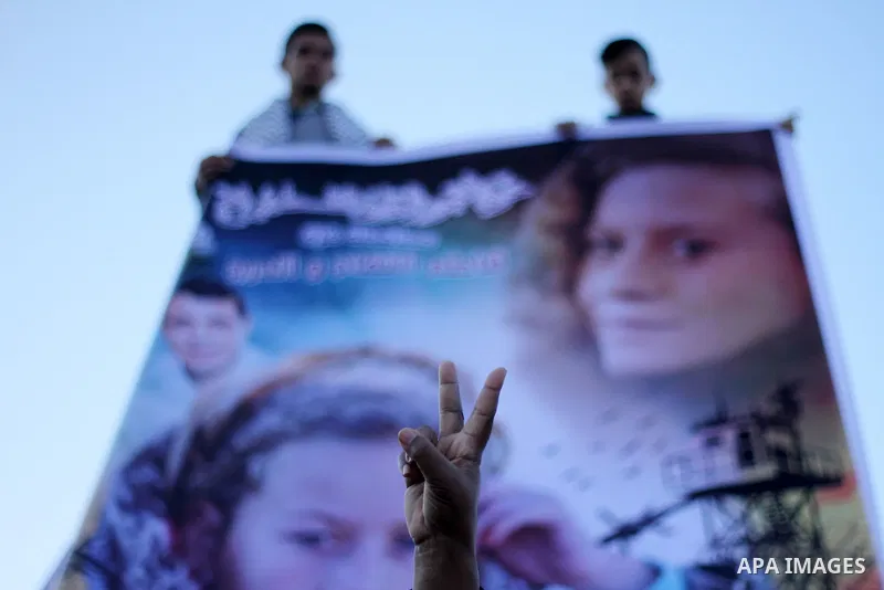 A Palestinian man flashes sign victory during a protest in support of Palestinian teenager Ahed Tamimi, 16-year-old in Gaza city on January 8, 2018. Israel charged Tamimi with 12 counts including assault on January 1 fol...