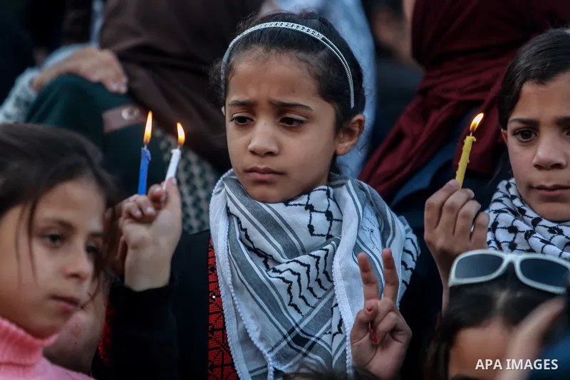 Palestinian children hold candles during a protest in support of Palestinian teenager Ahed Tamimi, 16-year-old in Gaza city on January 8, 2018. Israel charged Tamimi with 12 counts including assault on January 1 followin...