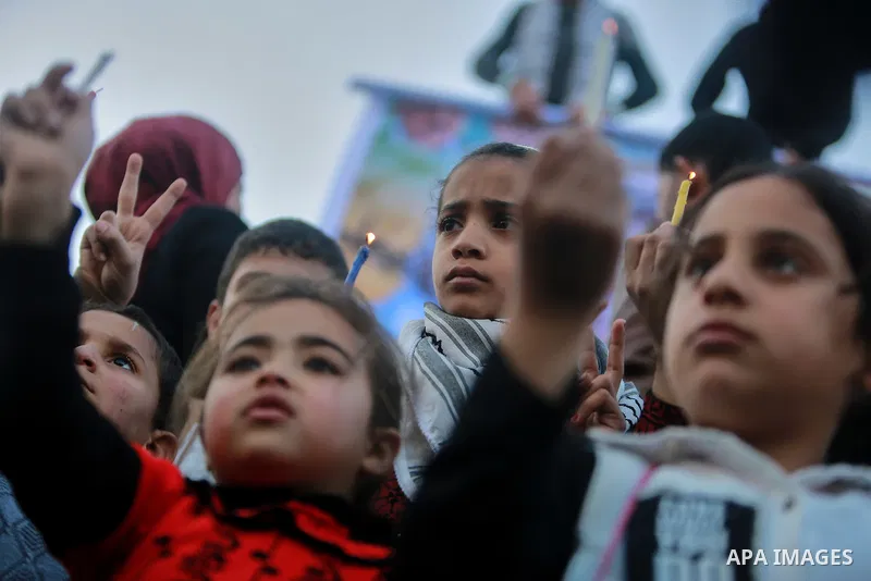 Palestinian children hold candles during a protest in support of Palestinian teenager Ahed Tamimi, 16-year-old in Gaza city on January 8, 2018. Israel charged Tamimi with 12 counts including assault on January 1 followin...