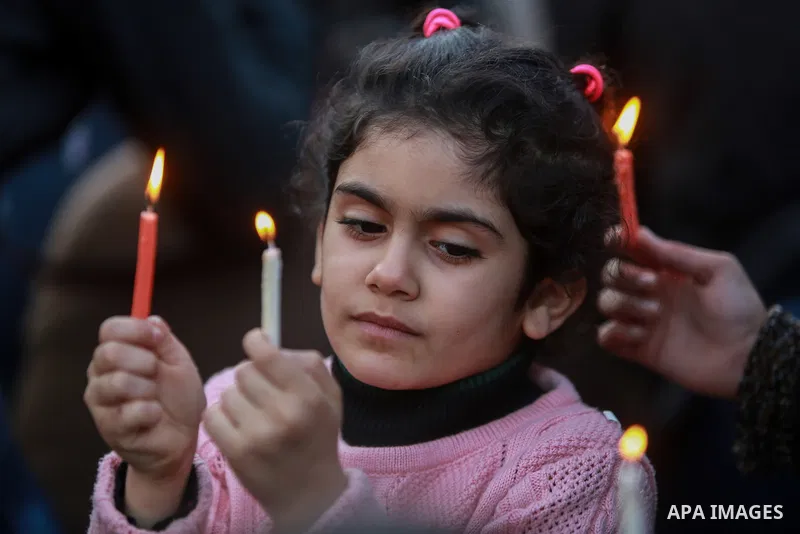 A Palestinian girl holds a candle during a protest in support of Palestinian teenager Ahed Tamimi, 16-year-old in Gaza city on January 8, 2018. Israel charged Tamimi with 12 counts including assault on January 1 followin...