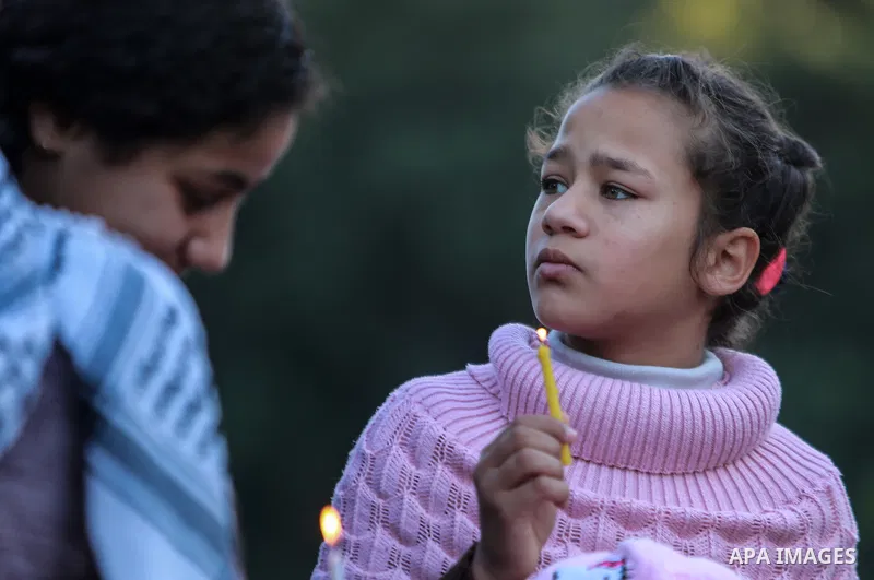Palestinian children hold candles during a protest in support of Palestinian teenager Ahed Tamimi, 16-year-old in Gaza city on January 8, 2018. Israel charged Tamimi with 12 counts including assault on January 1 followin...