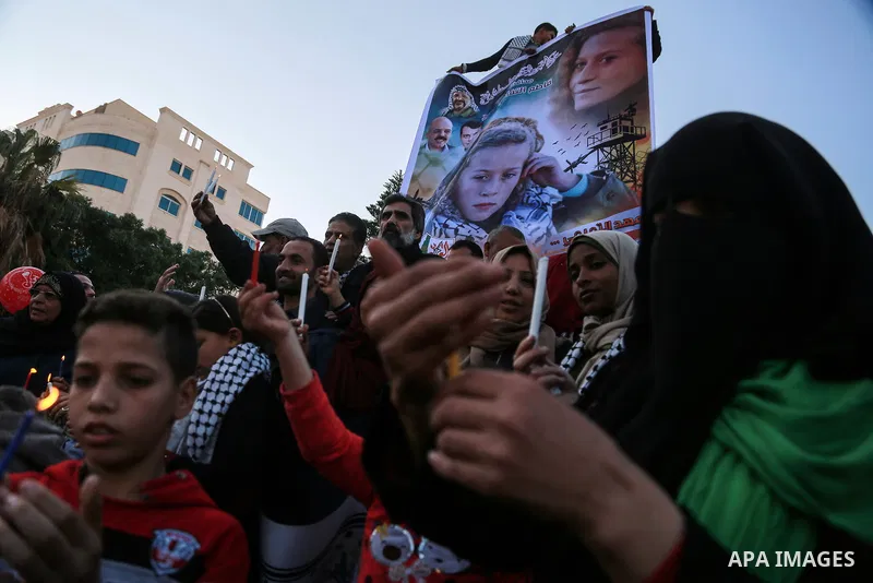 Palestinians hold candles during a protest in support of Palestinian teenager Ahed Tamimi, 16-year-old in Gaza city on January 8, 2018. Israel charged Tamimi with 12 counts including assault on January 1 following her ar...