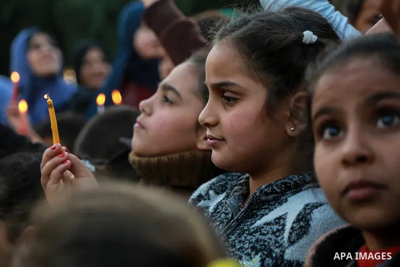 Palestinian children hold candles during a protest in support of Palestinian teenager Ahed Tamimi, 16-year-old in Gaza city on January 8, 2018. Israel charged Tamimi with 12 counts including assault on January 1 followin...