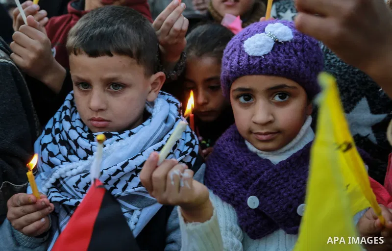 Palestinian children hold candles during a protest in support of Palestinian teenager Ahed Tamimi, 16-year-old in Gaza city on January 8, 2018. Israel charged Tamimi with 12 counts including assault on January 1 followin...