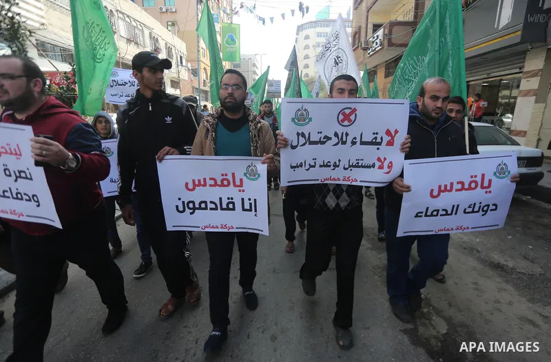 Palestinians hold national flags during a protest against U.S. President Donald Trump's decision to recognise Jerusalem as the capital of Israel, in Gaza city on January 9, 2018. Photo by Mohammed Asad