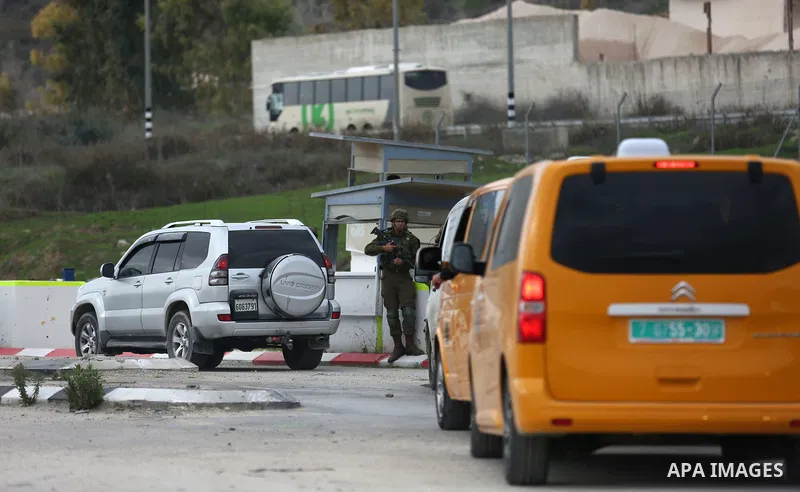 Israeli forces close a road on January 10, 2018 in the area where a 35-year-old Israeli rabbi was killed late the previous day while driving near the wildcat settlement where he lived, around the West Bank village of Jit...