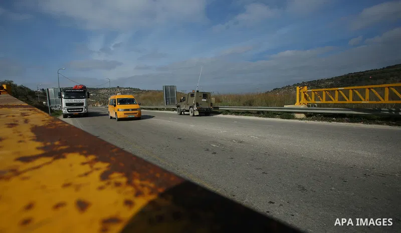 Israeli forces close a road on January 10, 2018 in the area where a 35-year-old Israeli rabbi was killed late the previous day while driving near the wildcat settlement where he lived, around the West Bank village of Jit...