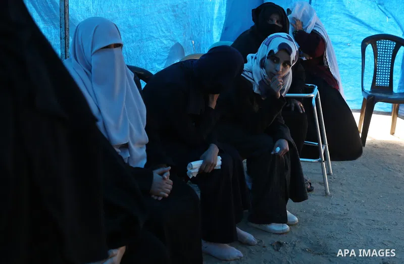 Palestinian relatives of Amir Abu Musaid, 16, mourn during his funeral in the al-Maghazi refugee camp, in the centre of the Gaza Strip, after he was shot dead in clashes with the Israeli military along the Gaza border th...