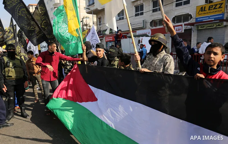 Palestinians take part in a protest against the US president's decision to recognise Jerusalem as the capital of Israel, at the al-Nusairat refugee camp, in central Gaza Strip, on January 12, 2018. Photo by Ashraf Amra