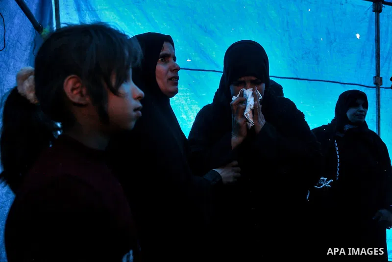 Palestinian relatives of Amir Abu Musaid, 16, mourn during his funeral in the al-Maghazi refugee camp, in the centre of the Gaza Strip, after he was shot dead in clashes with the Israeli military along the Gaza border th...