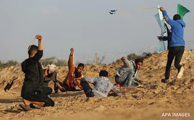 Palestinian protesters clash with Israeli forces at the Bureij refugee camp, in central Gaza on January 12, 2018 as demonstrations continue over the US president's controversial recognition of Jerusalem as Israel's capit...