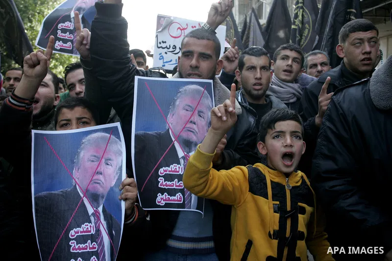 Palestinian supporters of Islamic Jihad movement take part in a protest against the US president's decision to recognise Jerusalem as the capital of Israel, in the town of Rafah in the southern Gaza Strip, on January 12,...