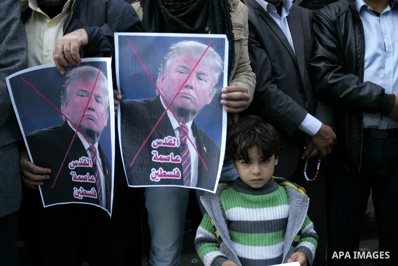 Palestinian supporters of Islamic Jihad movement take part in a protest against the US president's decision to recognise Jerusalem as the capital of Israel, in the town of Rafah in the southern Gaza Strip, on January 12,...
