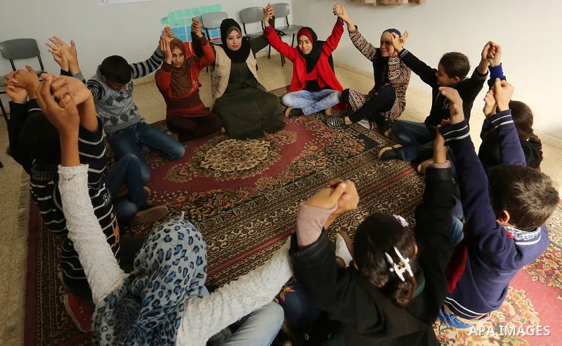 Palestinian children take a yoga lesson which organized by the center for Mind- Body Medicine, in Gaza city on January 10, 2018. The Center for Mind-Body Medicine is a non- profit, educational organization founded in Was...