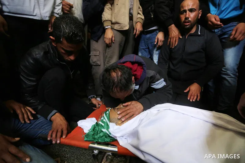 Palestinian relatives mourn during the funeral of Abdullah Zeidan, a 33-year-old fisherman, in Gaza City on January 13, 2018. A fisherman from the Gaza Strip was shot dead by the Egyptian army overnight for unclear reaso...
