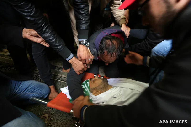 Palestinian relatives mourn during the funeral of Abdullah Zeidan, a 33-year-old fisherman, in Gaza City on January 13, 2018. A fisherman from the Gaza Strip was shot dead by the Egyptian army overnight for unclear reaso...