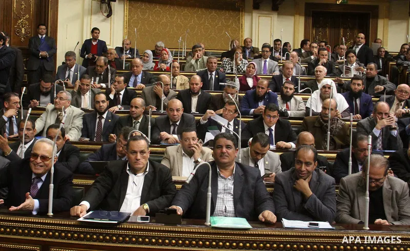 Egyptian parliament members attend the parliament emergency session to vote the ministerial amendment, in Cairo, Egypt, on January 14, 2018. Photo by Stringer