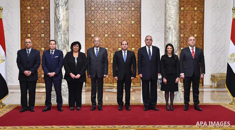 Egyptian President Abdel-Fattah el-Sissi, right, listens to the new ministers during a swearing-in ceremony for new cabinet ministers, in Cairo, Egypt, on January 14, 2018. Photo by Egyptian President Office