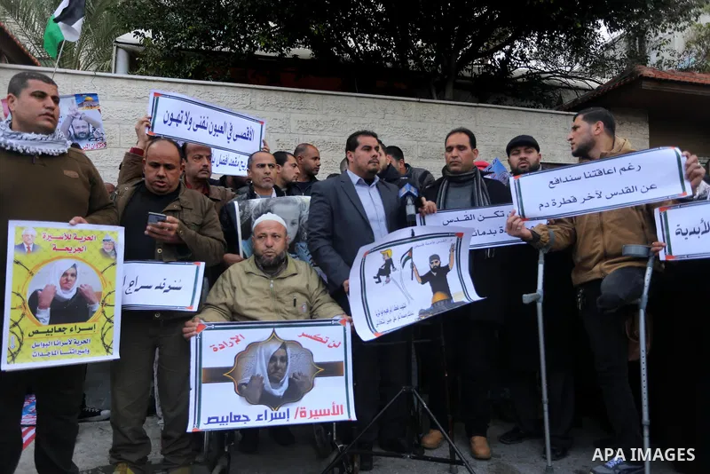 Palestinians take part in a protest against the US president's decision to recognise Jerusalem as the capital of Israel in front of Red Cross office, in Gaza city on January 15, 2018. Photo by Mohammed Asad