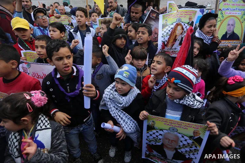 Palestinian children take part in a protest in support of Palestinian teenager Ahed Tamimi, 16-year-old in in front of Red Cross office, in Gaza city on January 15, 2018. Photo by Mohammed Asad