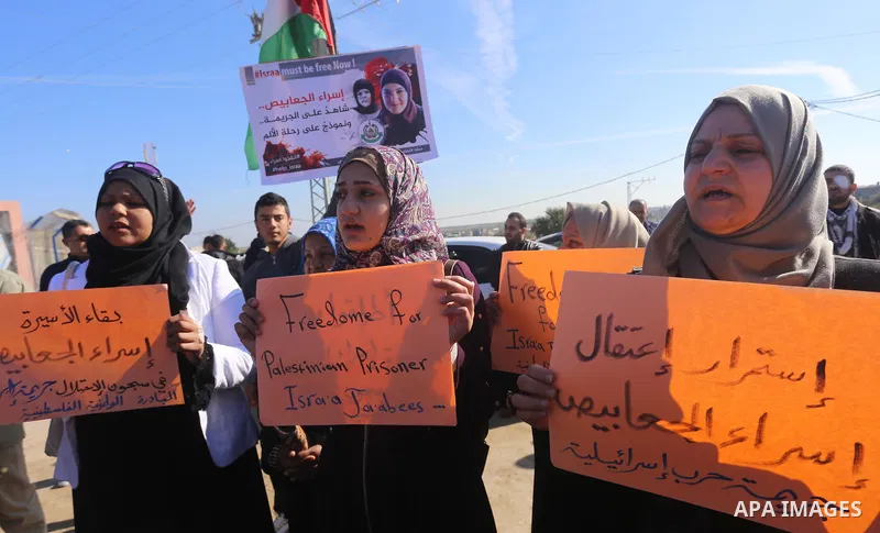 Palestinian members of National and Islamic forces take part in a protest of solidarity with prisoner Esraa Al-Jabbais held in Israeli jails in the northern Gaza Strip, on January 16, 2018. Photo by Mohammed Asad