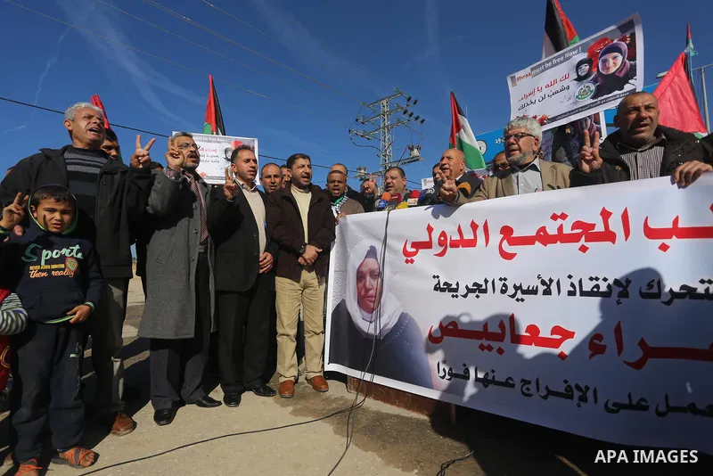 Palestinian members of National and Islamic forces take part in a protest of solidarity with prisoner Esraa Al-Jabbais held in Israeli jails in the northern Gaza Strip, on January 16, 2018. Photo by Mohammed Asad