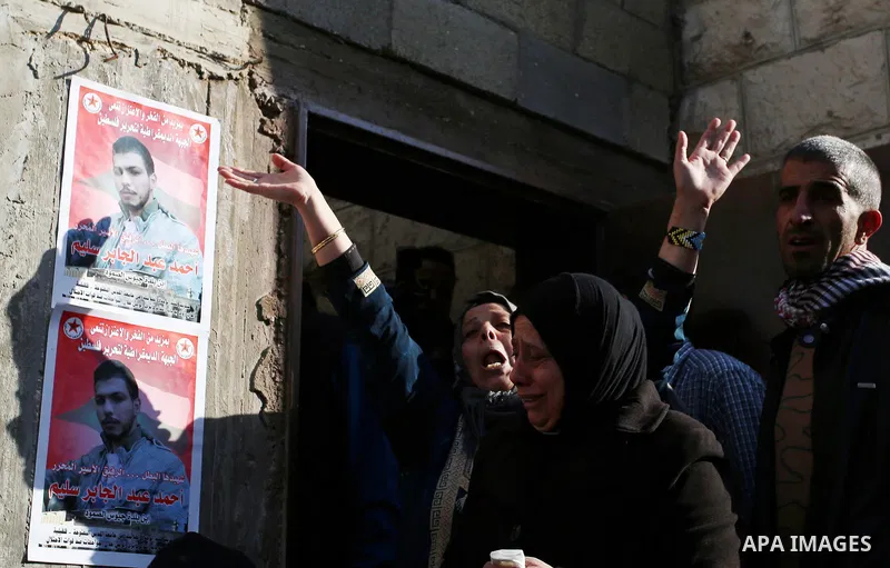 Palestinians mourn during the funeral of Ahmad Saleem who was shot dead during clashes with Israeli security foces on the previous day in the West Bank village of Jayous near Qalqilya January 16, 2018. Photo by Shadi Jar...