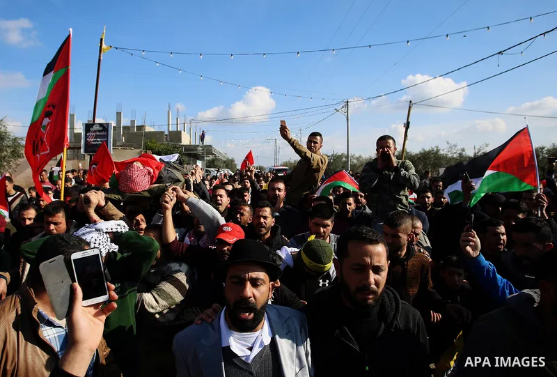 Palestinian mourners carry the body of Ahmad Saleem who was shot dead during clashes with Israeli security foces on the previous day during his funeral in the West Bank village of Jayous near Qalqilya January 16, 2018. P...