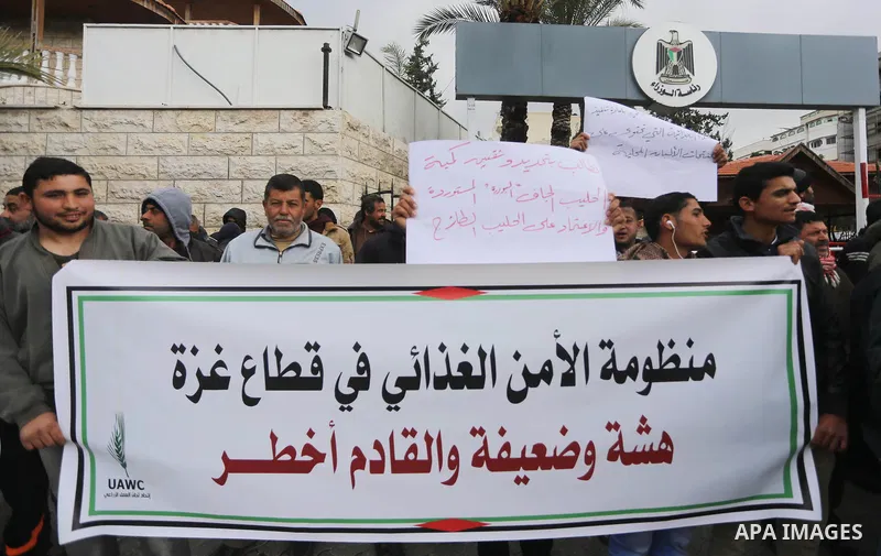 Palestinians of the Union of Agricultural Work Committees take part in a rally to support of the national product, in front of the headquarters of the Council of Ministers in Gaza city on January 17, 2018. Photo by Moham...