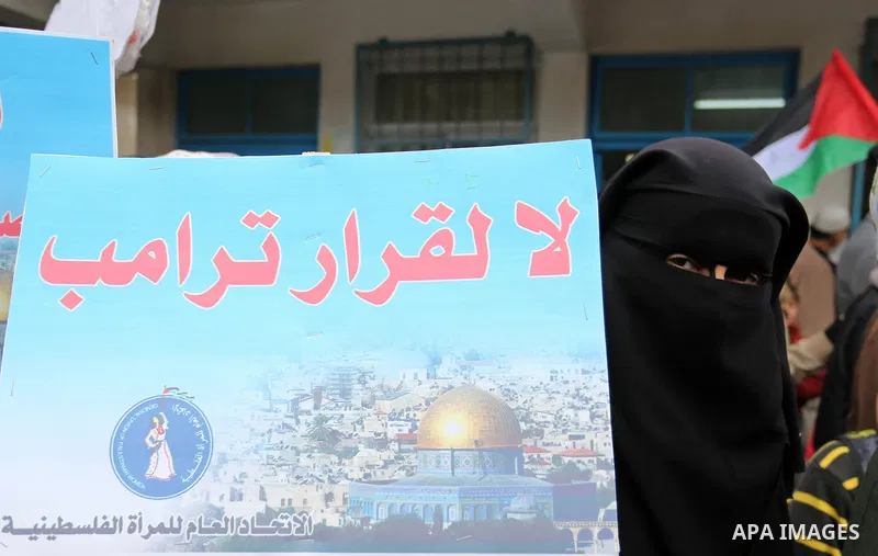 Palestinians take part in a protest against aid cut, in front of the headquarters United Nations Relief and Works Agency (UNRWA) in al-Nusirat refugee camp in the Gaza strip on January 17, 2018 after the White House froz...