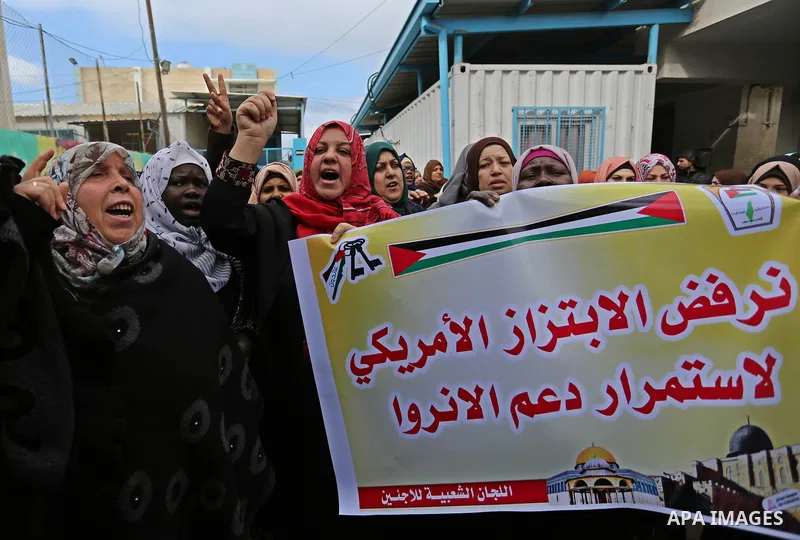 Palestinians take part in a protest against aid cut, in front of the headquarters United Nations Relief and Works Agency (UNRWA) in al-Nusirat refugee camp in the Gaza strip on January 17, 2018 after the White House froz...
